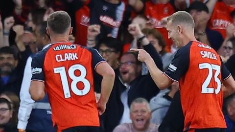 George Saville celebrates scoring for Luton against Wigan