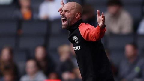 MK Dons boss Paul Warne shouts at his team