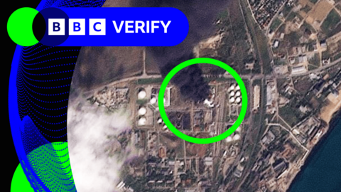 Satellite image showing a large plume of smoke coming from an oil refinery