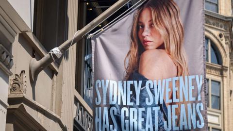 An advertisement featuring actress Sydney Sweeney outside an American Eagle store in New York, US.