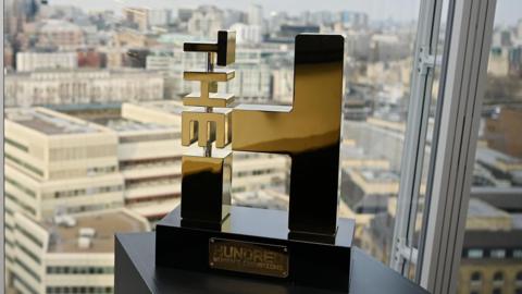 The Hundred trophy with the city of London in the background