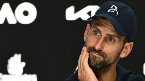 Novak Djokovic reacts during his Australian Open news conference