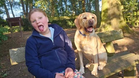 Betsy with support dog Rodney