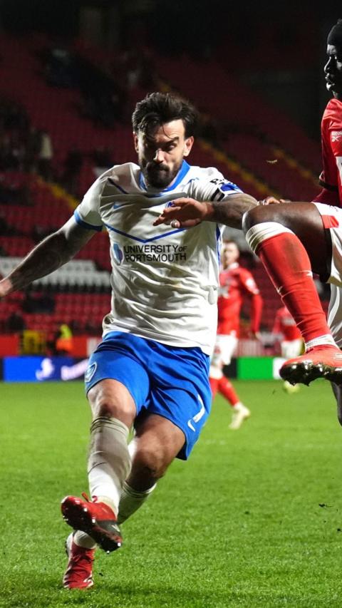 Footballer kicks towards the camera.