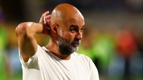 Manchester City manager Pep Guardiola with his hand on his head