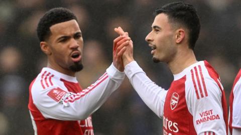 Arsenal forwards Ethan Nwaneri and Gabriel Martinelli high five