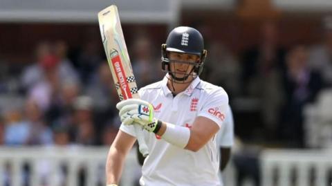 Jamie Smith celebrating a half-century for England