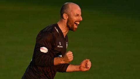 Jack Leach, wearing Somerset's black T20 shirt, celebrates taking a wicket against Worcestershire