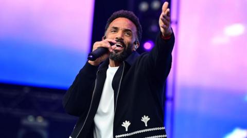 Image of Craig David on stage.