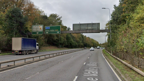 The A45 dual carriageway is shown, with a sign above both sides of the road showing the lanes for routes. 