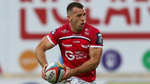 Wales scrum-half Gareth Davies attacks with the ball for Scarlets against Munster