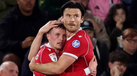 Nathan Broadhead of Wrexham (L) celebrates scoring his team's first goal with teammate Kieffer Moore