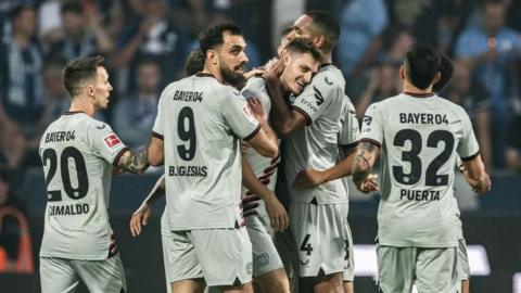 Bayer Leverkusen players celebrate scoring against Bochum