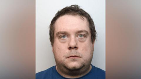 Mugshot of Christopher Saunders-Pope.