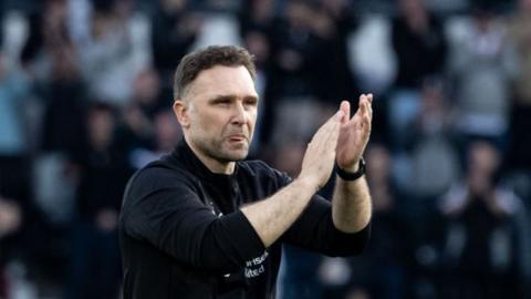 Derby County boss John Eustace applauding the fans