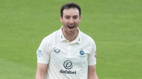 Toby Roland-Jones celebrates on the field