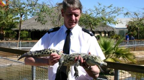 Mike Flynn with rescued alligator