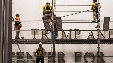 Workers put up scaffolding prior to the removal of President Donald Trump's name from the Kennedy Center on June 12, 2026 in Washington, DC.