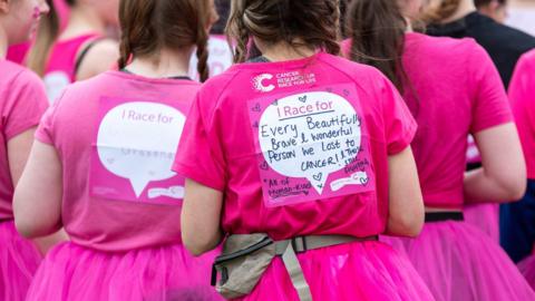 Runners dressed in pink fundraising for 