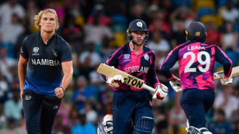 Namibia's Ruben Trumpelmann looks on as Scotland's Richie Berrington and Michael Leask run during a match in 2024