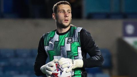 Marko Marosi warming up with Plymouth Argyle