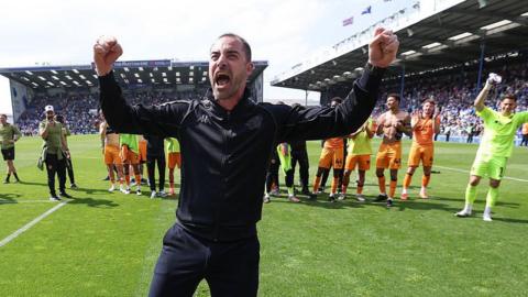 Ruben Selles celebrates his side staying up after a point at Fratton Park