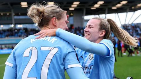 Manchester City's Rebecca Knaak and Lauren Hemp celebrate their win over Liverpool