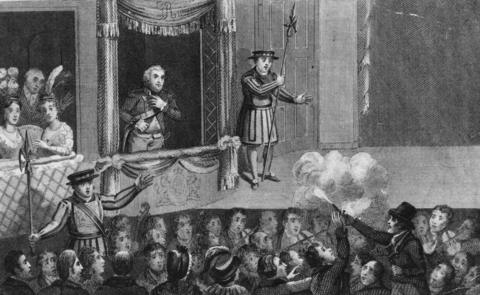 A black and white drawing of a crowded theatre in the 19th century. There is a man wearing a uniform standing in a first-floor balcony box with a group of women sitting in a box to his left and a guard on his right. Below, a man wearing a dark jacket and a top hat is pointing a gun at him and firing, and a cloud of smoke appears. There are people around staring at the gunman. 