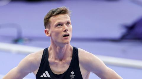 Max Burgin looks up to the big screen following the men's 800m final at Paris 2024