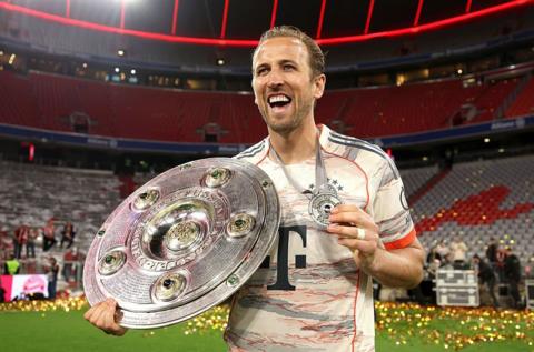 Harry Kane, who has scored 61 goals in two Bundesliga seasons so far, celebrated lifting his first career trophy