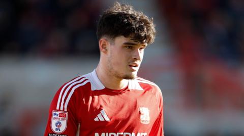 Jamie Knight-Lebel in action for Swindon Town.