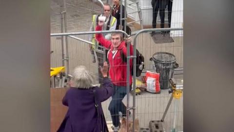 Man appears to launch at object at Nigel Farage's campaign bus in Barnsley