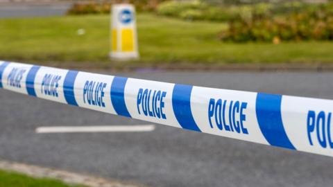 Police marker tape for cordoning crime scene.