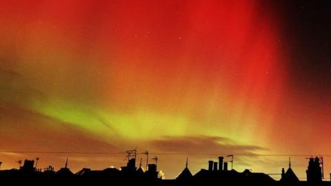 The Northern Lights over the rooftops of Leith.
