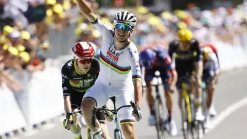 Tadej Pogacar celebrates winning stage seven of the 2025 Tour de France