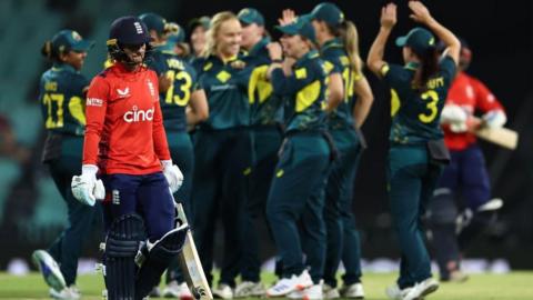 England batter Danni-Wyatt Hodge leaves the field after being dismissed by Australia