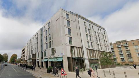 The Clayton Hotel in Cambridge, shown with people walking by