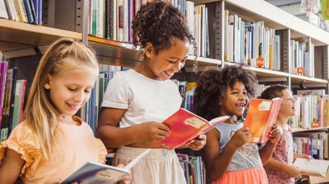 Children reading in a library 