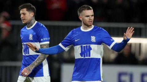 Birmingham City's Marc Leonard holds his arms out trying to calm his team-mates after conceded a goal