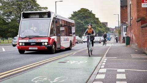 Bus and cyclist in West Yorkshire