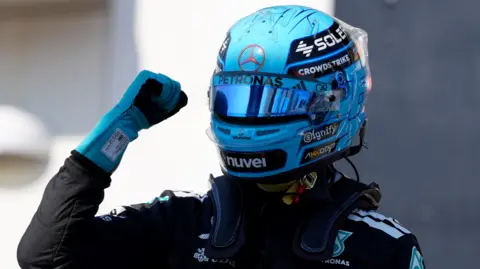 George Russell clenches his right fist in celebration after taking pole position for the Canadian Grand Prix