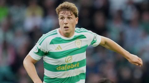 Arne Engels in action for Celtic, wearing a jersey with green and white hoops