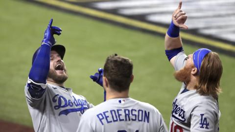 Dodgers trio Max Muncy, Joc Peterson and Justin Turner celebrate a home run