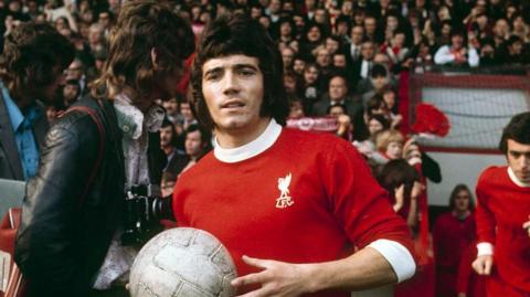 Kevin Keegan coming out of the tunnel at Anfield carrying a football before a match