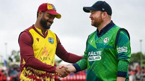 Ireland's Paul Stirling shakes hands with West Indies counterpart Shai Hope