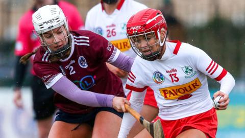 Dicksboro's Jane Cass tackles Caitrin Dobbin of Loughgiel Shamrocks