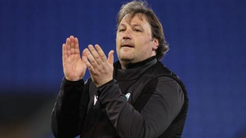 TNS manager Craig Harrison applauds