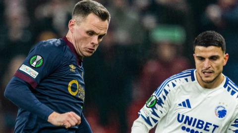 Hearts' Lawrence Shankland (left) in action against Copenhagen