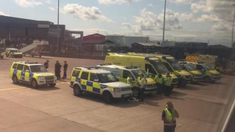 Police near plane at Manchester Airport