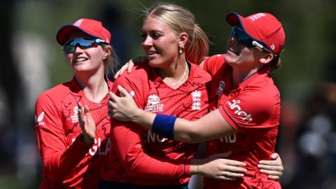 Charlie Dean (L) and Heather Knight (R) celebrate a wicket with Sarah Glenn (middle)